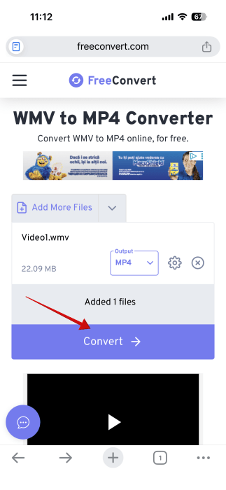 Pressing "Convert" button in FreeConvert web tool to begin WMV file conversion on iPhone. 