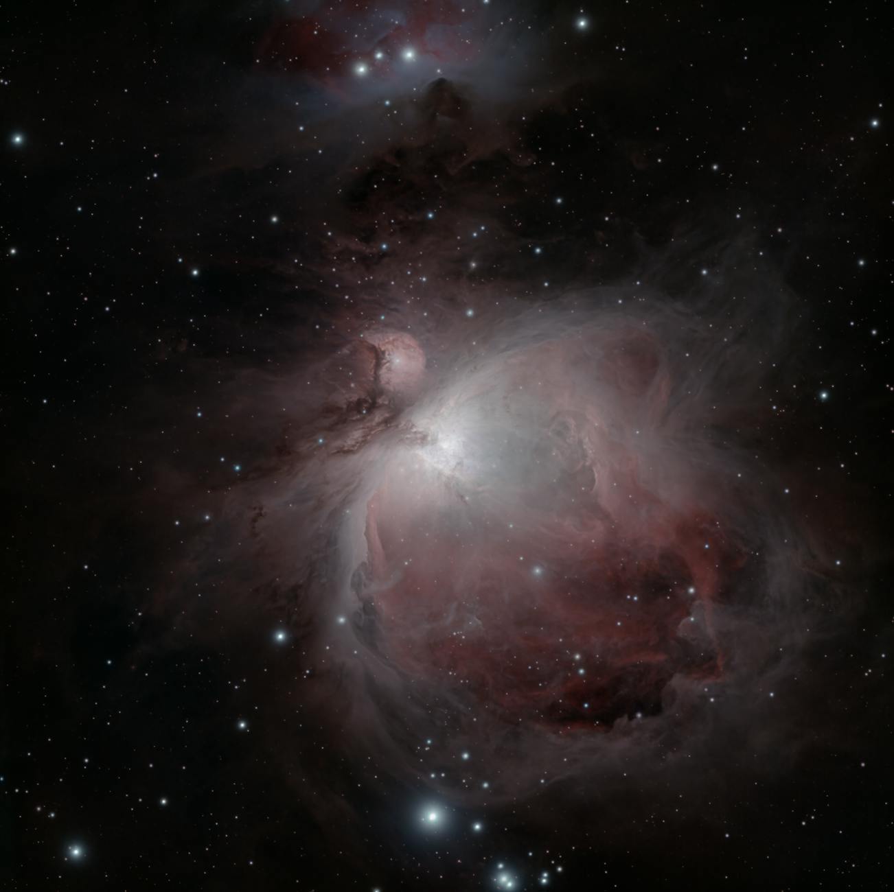 Stunning capture of the Orion Nebula (M42) with sparkling stars and vibrant emission clouds.
