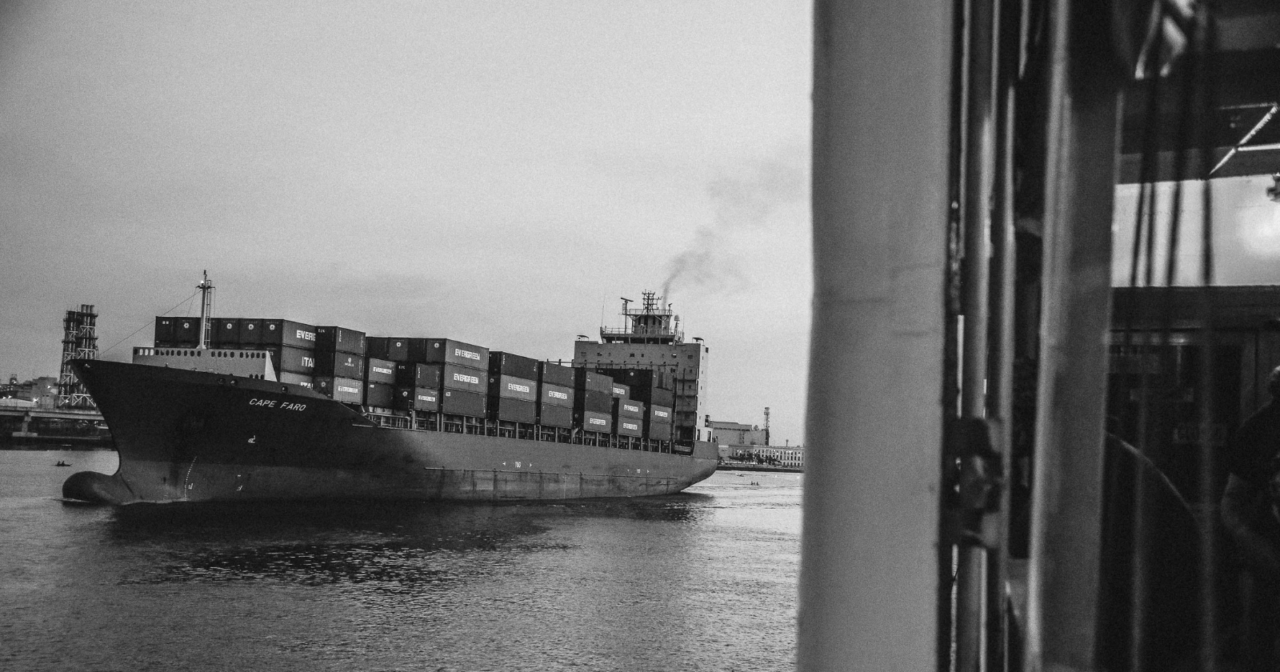 How did a 1956 shipping container standardised at 8 by 8 by 20 feet cut cargo loading costs from about $5.83 a tonne to 16 cents and quietly rebuild world trade?