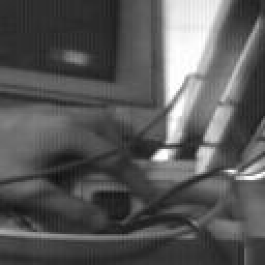Grainy grayscale final frame from the Trojan Room coffee pot camera showing three fingers on a power switch
